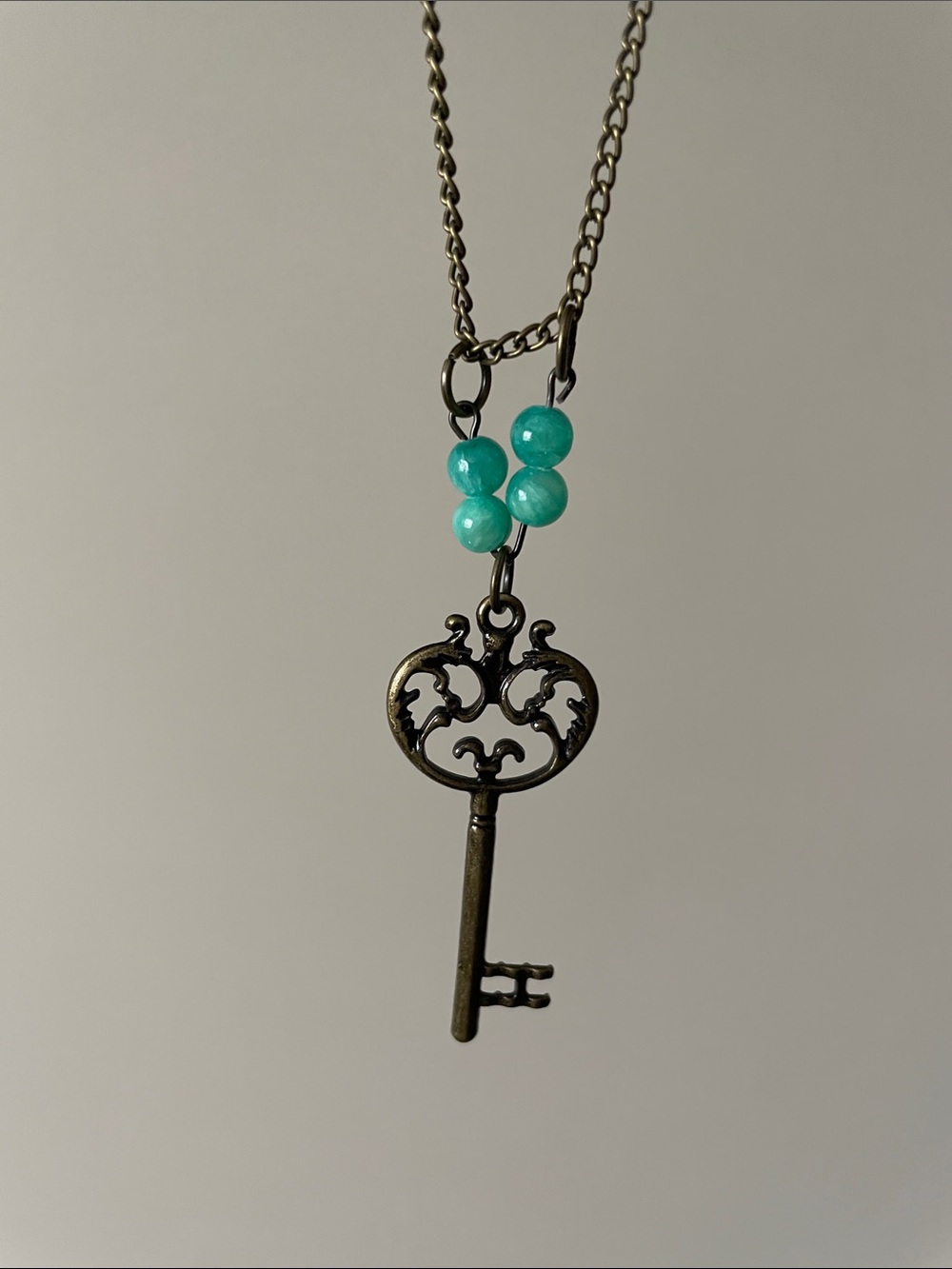 Light Green Turquoise Round gemstone + key Necklace.